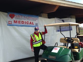 Man beside a medical cart